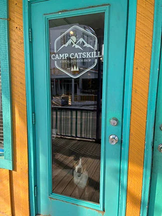Doggie in doorway of Camp Catskill